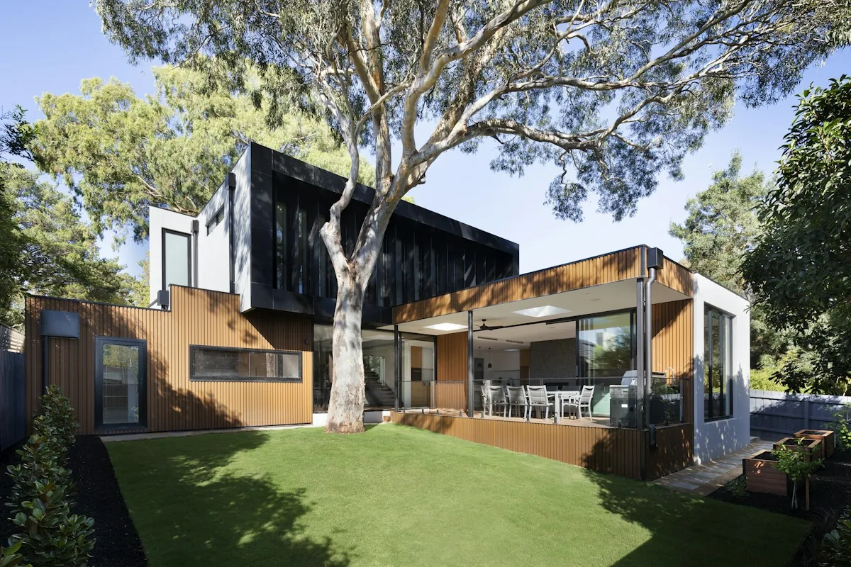 Illustrative contemporary home with a tree-shaded garden