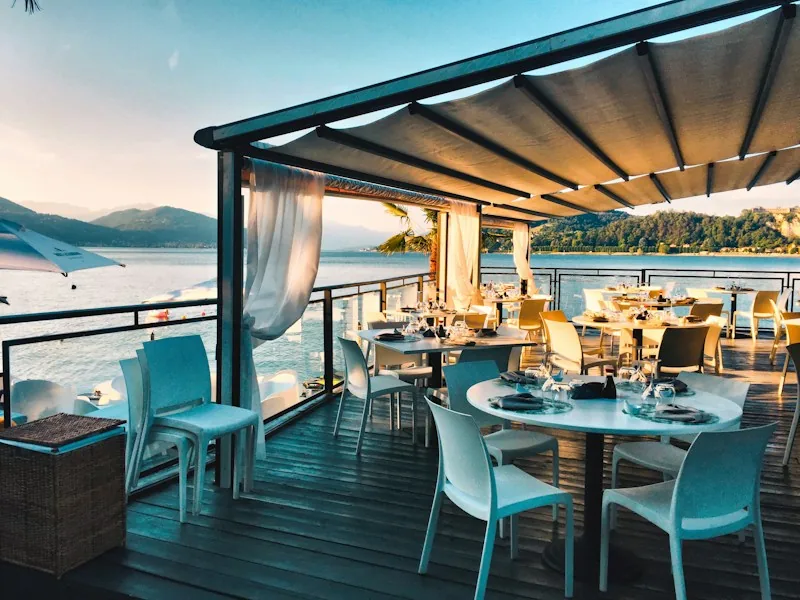 A softly lit restaurant terrace set for the evening